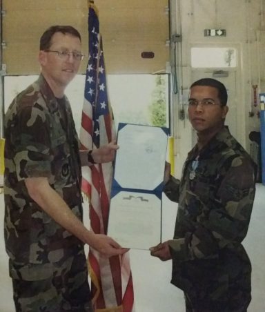 Photo of me receiving a medal from my squadron commander